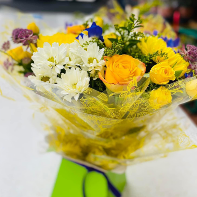 Sunrise - Energise their day with a stunning surprise. A warm collection of seasonal flowers artistically arranged by an artistic florist. Available for same day delivery when ordered before 2pm.