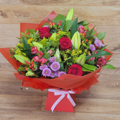 Mrs Kisses - Send lots of love and kisses with this classic hand-tied bouquet featuring a selection of romantic flowers finished with a luxurious single red rose.