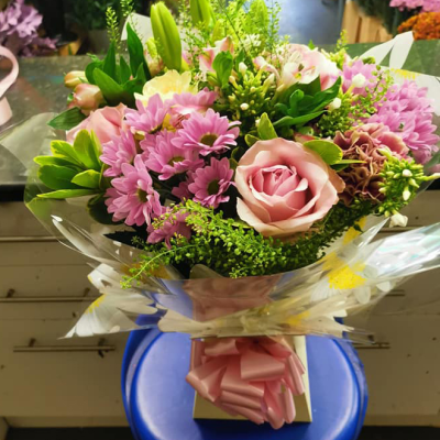 Ashleigh - A budding delight, complimented by greenery and presented in a gift box/bag. Beautiful flower bouquet hand delivered by the local florist.