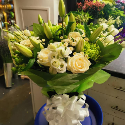 Evelyn - A fabulous collection of white and cream flowers make this the perfect gift. This bouquet will be hand delivered by the local florist.